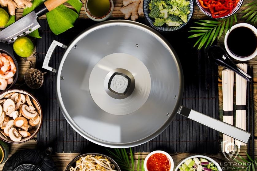 A photo of the 12" Frying Pan Wok Silver | Oberon Series | herniaquestions in the middle of different kinds of vegetables